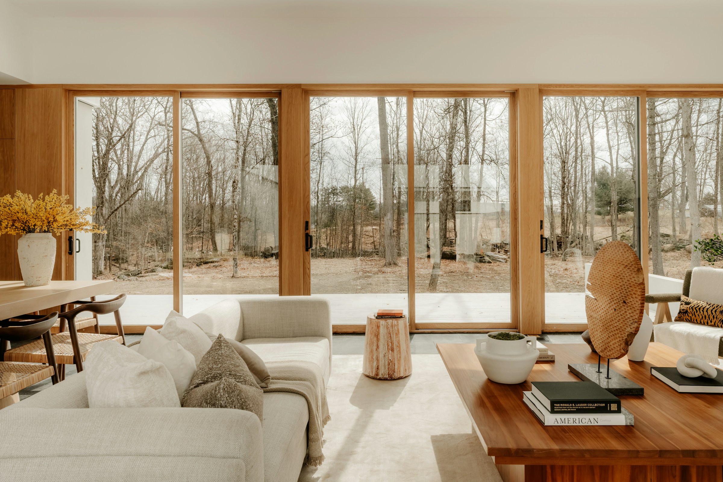 Natural light filling a living room with large windows