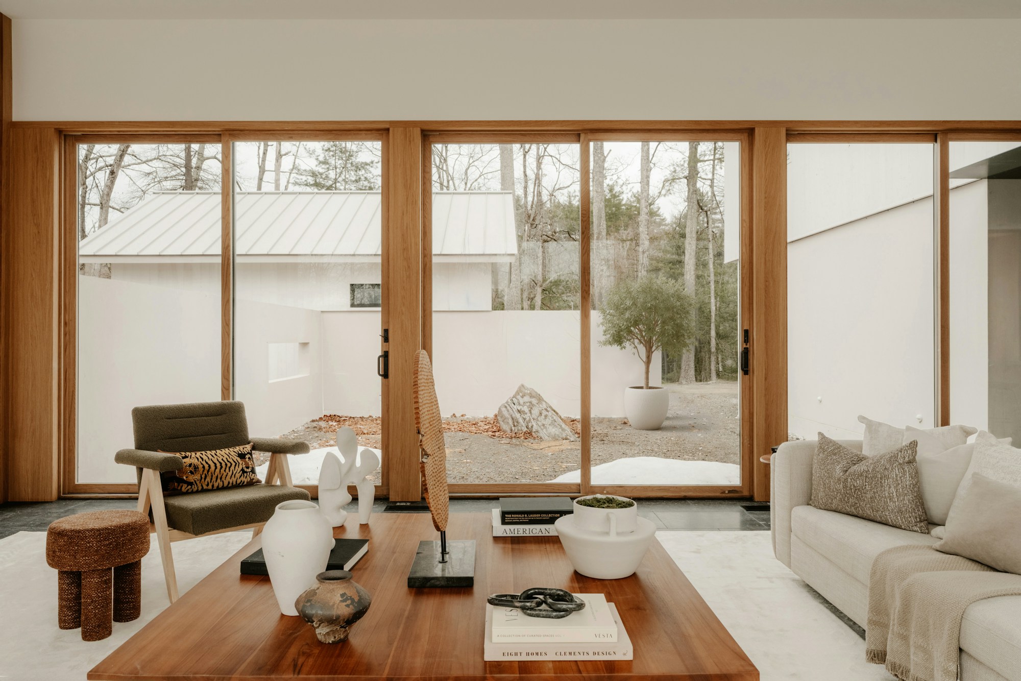 Living space with floor-to-ceiling garden-facing windows